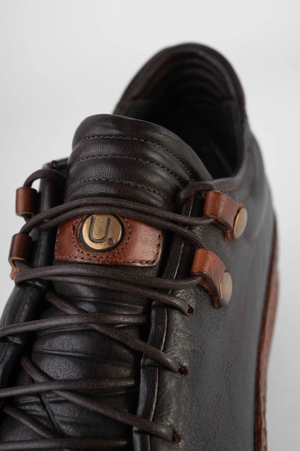 COLE dark-cocoa welted distressed sneakers.