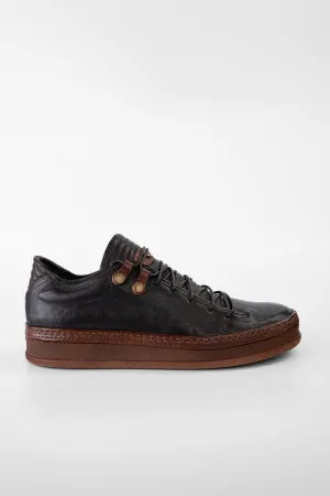 COLE dark-cocoa welted distressed sneakers.