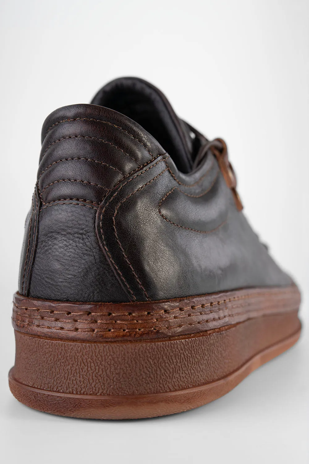 COLE dark-cocoa welted distressed sneakers.