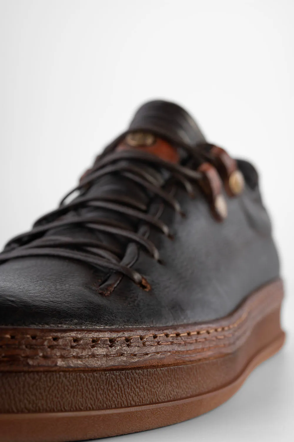 COLE dark-cocoa welted distressed sneakers.