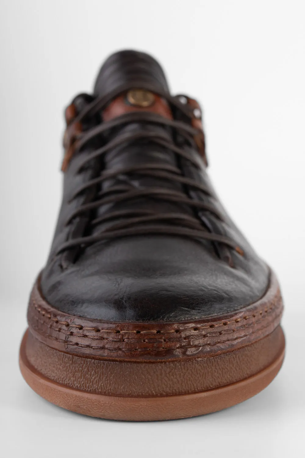 COLE dark-cocoa welted distressed sneakers.